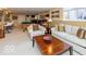 Spacious basement lounge area with comfortable seating and a coffee table at 12954 Water Ridge Dr, Fishers, IN 46055