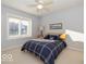 Charming bedroom with a queen-size bed and ceiling fan at 12954 Water Ridge Dr, Fishers, IN 46055