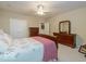 Comfortable bedroom with double doors and dresser at 12954 Water Ridge Dr, Fishers, IN 46055