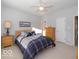 Comfortable bedroom with a queen-size bed and ceiling fan at 12954 Water Ridge Dr, Fishers, IN 46055