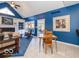 Bright dining area with a table and chairs, adjacent to a living room and access to a deck at 12954 Water Ridge Dr, Fishers, IN 46055