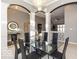 Elegant dining room with a glass table and modern chandelier at 12954 Water Ridge Dr, Fishers, IN 46055