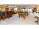 Finished basement game room with pool table, bar, and seating at 12954 Water Ridge Dr, Fishers, IN 46055