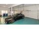 Finished garage with epoxy floor and car at 12954 Water Ridge Dr, Fishers, IN 46055