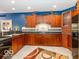Modern kitchen with wood cabinets and dark countertops at 12954 Water Ridge Dr, Fishers, IN 46055