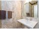 Elegant powder room with pedestal sink and decorative mirror at 12954 Water Ridge Dr, Fishers, IN 46055