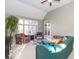 Relaxing sunroom with comfortable seating and plenty of natural light at 12954 Water Ridge Dr, Fishers, IN 46055