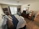 Spacious bedroom with king-size bed, sitting area, and ample closet space at 3250 Valley Farms Way, Indianapolis, IN 46214