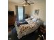 Cozy bedroom with a double bed, dresser, and ceiling fan at 3250 Valley Farms Way, Indianapolis, IN 46214