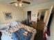 Bright bedroom with a double bed, walk-in closet, and ceiling fan at 3250 Valley Farms Way, Indianapolis, IN 46214