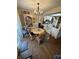 Cozy dining area with wood floors and chandelier at 3250 Valley Farms Way, Indianapolis, IN 46214