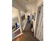 Upstairs hallway with tile flooring and access to bedrooms at 3250 Valley Farms Way, Indianapolis, IN 46214