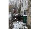 Small patio with table and chairs covered in snow at 3250 Valley Farms Way, Indianapolis, IN 46214