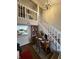 Home office space with wooden desk, bookshelves, and staircase view at 3250 Valley Farms Way, Indianapolis, IN 46214