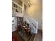 Home office space with wooden desk, bookshelves, and staircase view at 3250 Valley Farms Way, Indianapolis, IN 46214