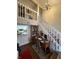 Home office space with wooden desk, bookshelves, and staircase view at 3250 Valley Farms Way, Indianapolis, IN 46214