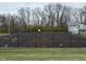 Older tennis court with asphalt surface showing wear and tear at 3250 Valley Farms Way, Indianapolis, IN 46214