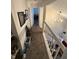 Upstairs hallway with access to bedrooms and stairs at 3250 Valley Farms Way, Indianapolis, IN 46214