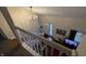 View from upstairs hallway to entryway and living room at 3250 Valley Farms Way, Indianapolis, IN 46214