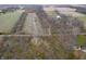Aerial view of property with home nestled amongst trees at 720 E 400 N, Anderson, IN 46012