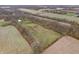 Aerial view of property showing house and surrounding fields at 720 E 400 N, Anderson, IN 46012