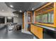 Basement bar with dark countertops and wood cabinets at 720 E 400 N, Anderson, IN 46012