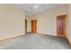 Simple bedroom with neutral walls, carpeting, and wood doors at 720 E 400 N, Anderson, IN 46012