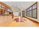 Light-filled dining area with hardwood floors and access to the kitchen at 720 E 400 N, Anderson, IN 46012