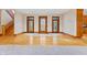 View of entryway with hardwood floors, tile, and staircase at 720 E 400 N, Anderson, IN 46012
