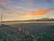 Field with powerline and sunset in background at 720 E 400 N, Anderson, IN 46012