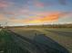 Field with powerline and sunset in background at 720 E 400 N, Anderson, IN 46012