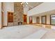 Spacious great room featuring a stone fireplace and hardwood floors at 720 E 400 N, Anderson, IN 46012