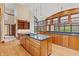 Open kitchen with granite countertops and wood cabinetry at 720 E 400 N, Anderson NE, IN 46012