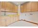 Bright laundry room with built-in cabinets and a utility sink at 720 E 400 N, Anderson, IN 46012