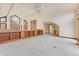 Vaulted living room with stone fireplace and built-in shelves at 720 E 400 N, Anderson, IN 46012