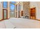 Open living room with high ceilings, stone fireplace, and hardwood floors at 720 E 400 N, Anderson NE, IN 46012
