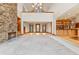 Two story living room with stone fireplace and hardwood floors at 720 E 400 N, Anderson, IN 46012