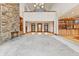 Spacious living room with high ceilings, stone fireplace, and hardwood floors at 720 E 400 N, Anderson, IN 46012
