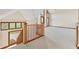 Open loft area with high ceilings and wood railing at 720 E 400 N, Anderson, IN 46012