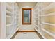 Large pantry with ample shelving and window at 720 E 400 N, Anderson, IN 46012