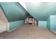 Unfinished attic room with window and exposed insulation at 1605 E Thompson Rd, Indianapolis, IN 46227