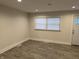 Living room featuring wood-look tile flooring and a large window at 1638 Dayton Ave, Indianapolis, IN 46203