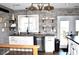 Kitchen with gray brick backsplash, white cabinets, and island at 5400 E Forster Ave, Columbus, IN 47201