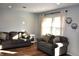 Living room with hardwood floors, two sofas, and a large window at 5400 E Forster Ave, Columbus, IN 47201