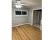 Bedroom with hardwood floors, neutral walls, and a ceiling fan at 6804 Bonny Dr, Indianapolis, IN 46221
