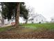 Landscaped yard with large tree and house visible in background at 8942 N State Road 39, Lizton, IN 46149