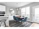Elegant dining area with a live edge table and modern blue velvet chairs at 1224 Alabama St, Indianapolis, IN 46202