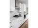 Modern kitchen with white cabinets, stainless steel appliances, and quartz countertops at 1224 Alabama St, Indianapolis, IN 46202
