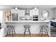 Modern kitchen with white cabinets, quartz island, and hardwood floors at 1224 Alabama St, Indianapolis, IN 46202
