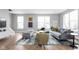 Spacious living room with hardwood floors, a large sectional sofa and an area rug at 1224 Alabama St, Indianapolis, IN 46202